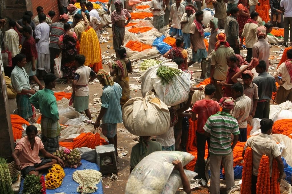 Marigold garlands and flower sellers at Kolkata's flower market
